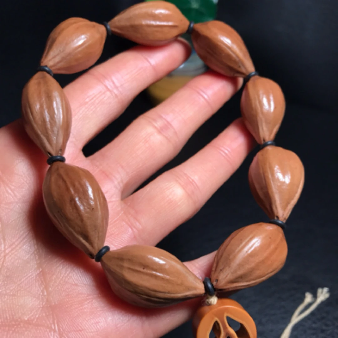 橄榄核铁核四花核原皮素核手串尺寸1.5*2.7cm文玩老树老料小素串