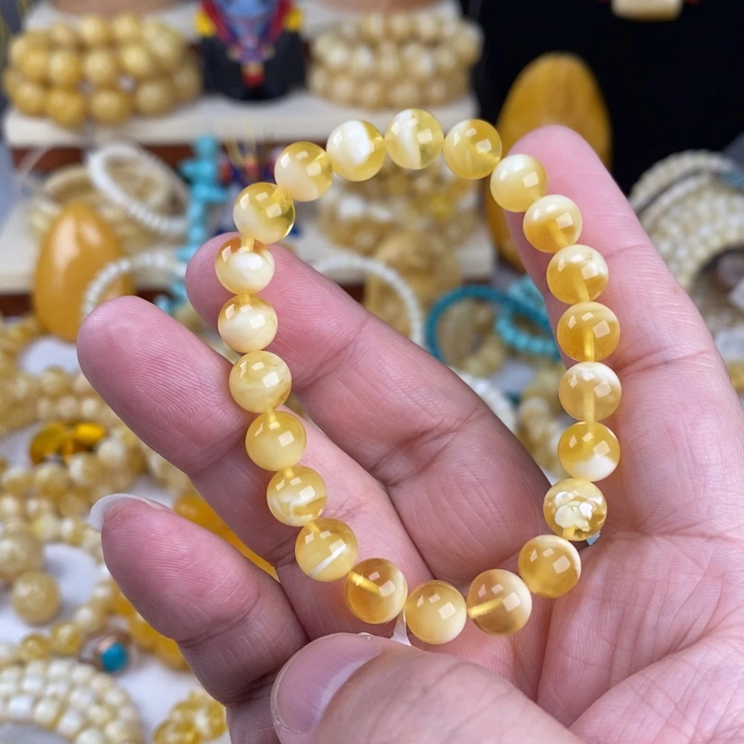 壹***壹蜜蜡未镶嵌手链金瓷白妖花8.5mm圆珠