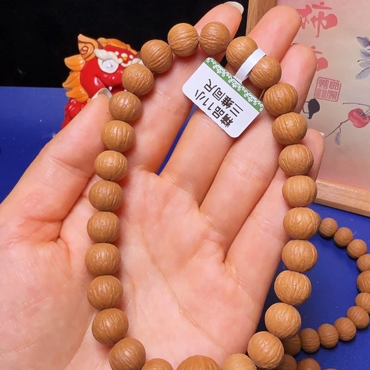 努***赤吊坠猴头核桃凤羽