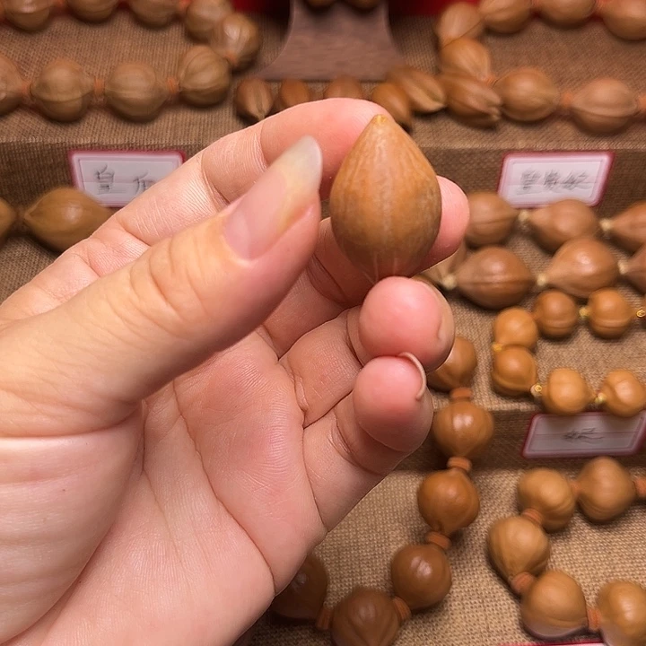 橄榄核吊坠榆****计橄榄核三通