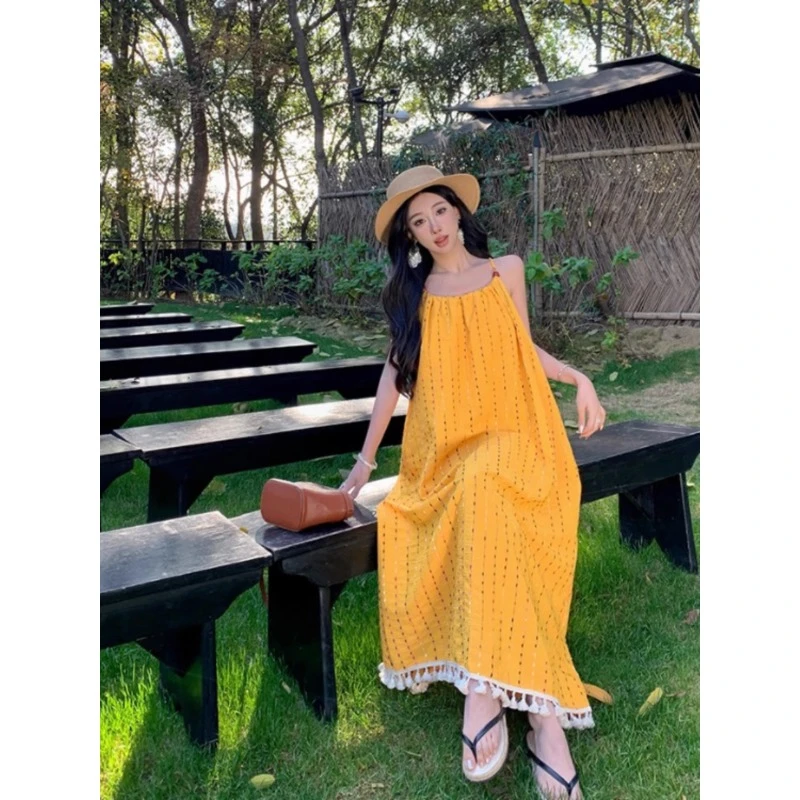 慵懒松弛感黄色流苏吊带显白连衣裙海边度假气质长裙绝美沙滩裙夏