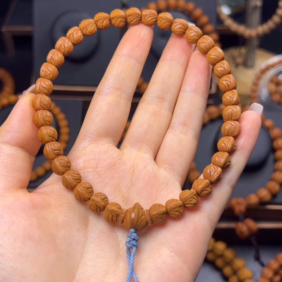 刘***蒙桃核手串野生玉龙脊0.8