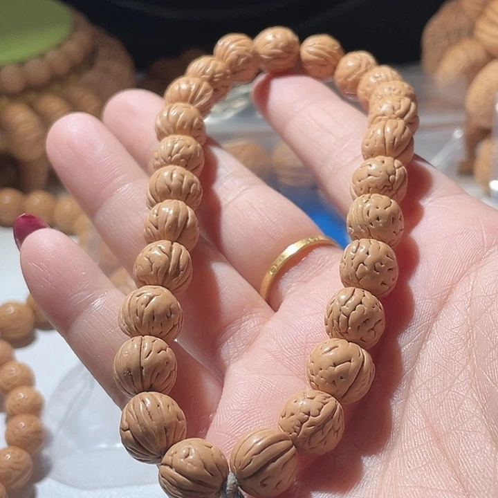 侯***屋桃核吊坠桃核手串野生20