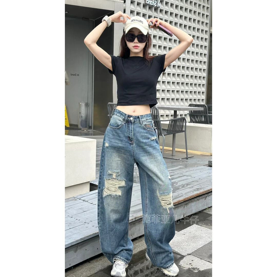 [纽约女孩]秋季新款破洞设计弯刀牛仔裤时尚个性小众风格复古