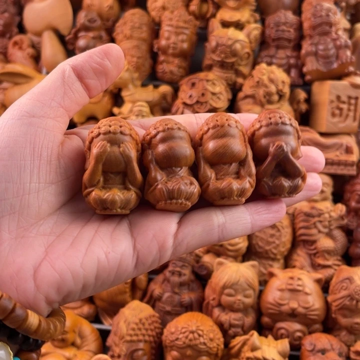 崖柏一物一拍手把件