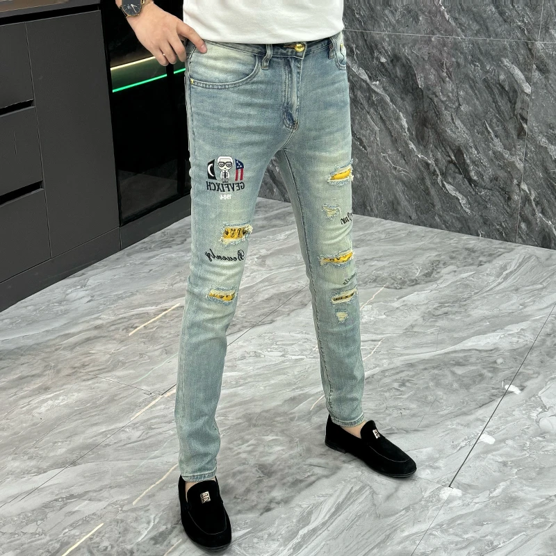 夏季时尚个性修身弹力小脚裤欧货破洞牛仔裤男士潮牌刺绣百搭长裤