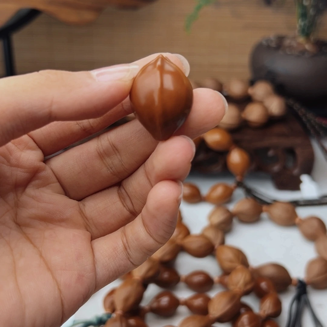o***o橄榄核手串19*26三花单籽