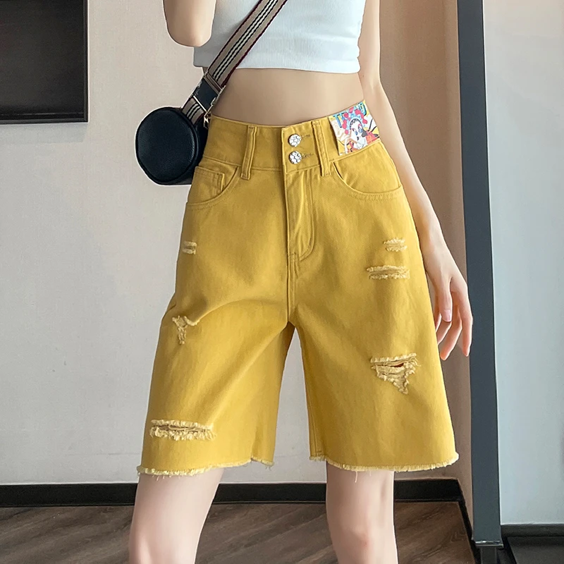 柠檬黄破洞五分牛仔短裤女夏季2025新款毛边撞色a字宽松阔腿热裤