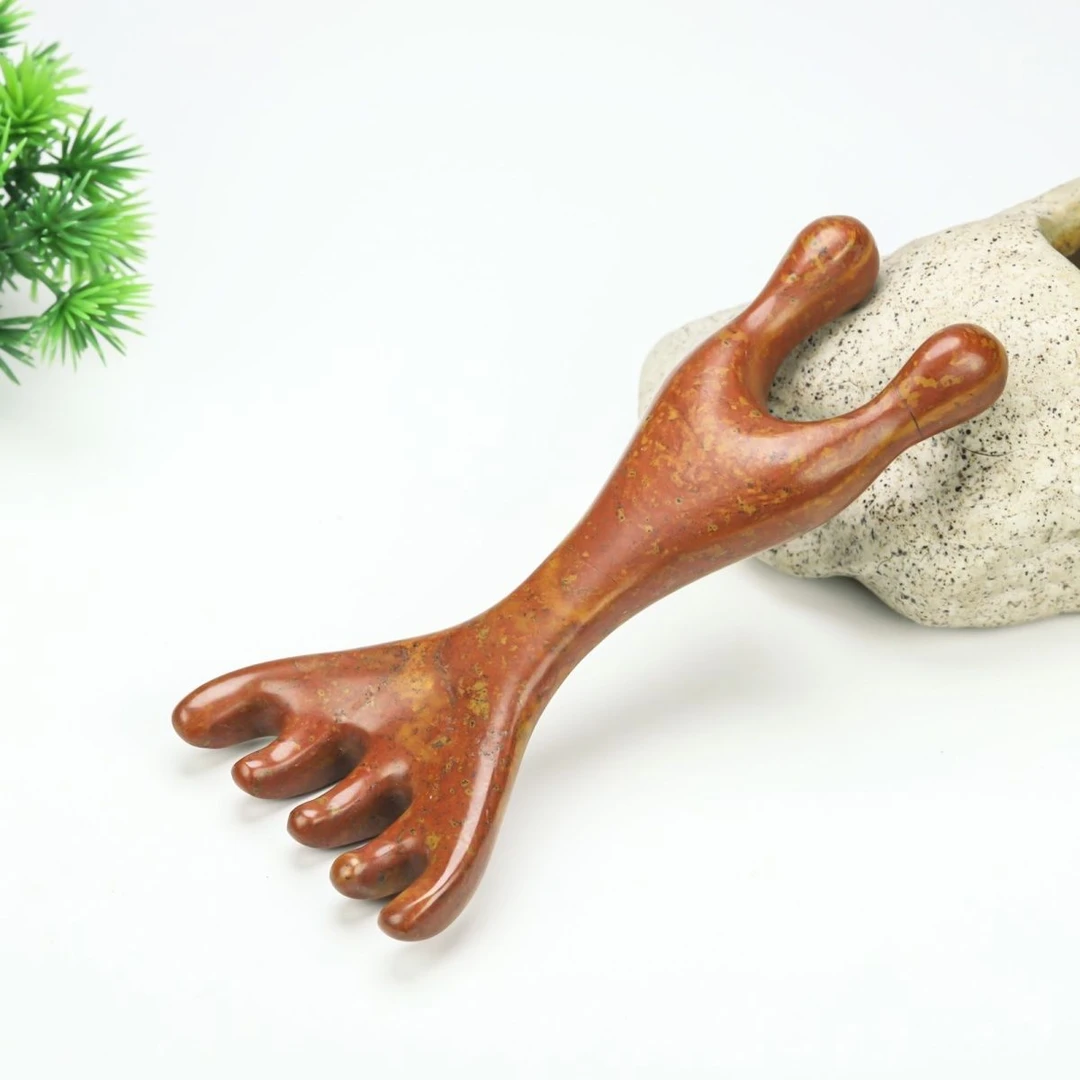 泗水砭石艺术馆砭石原石五爪娃娃梳