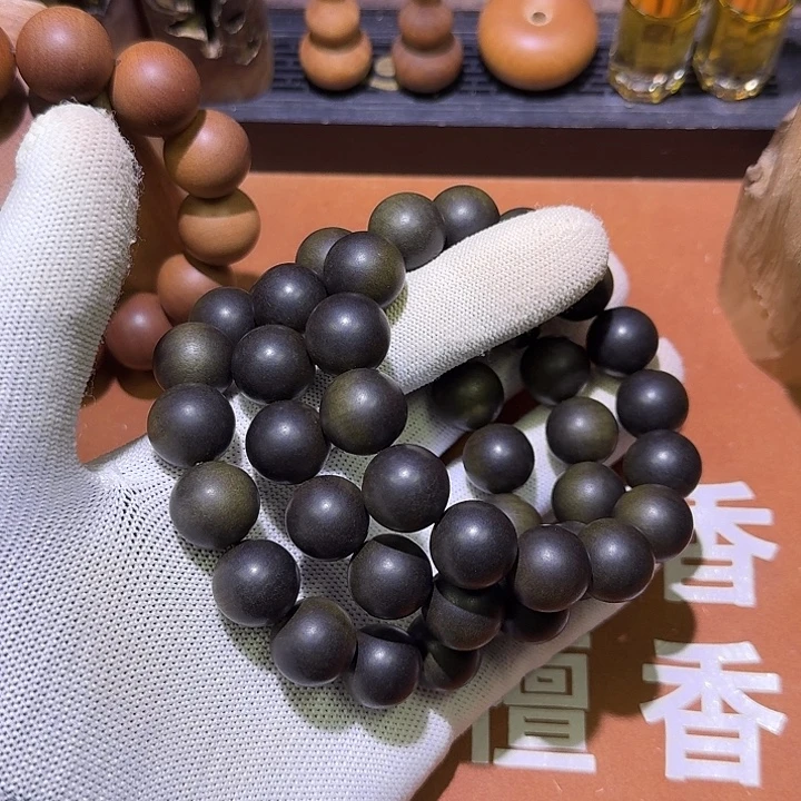 裕***轩檀香木老山檀香阴沉料1.5×15颗3串