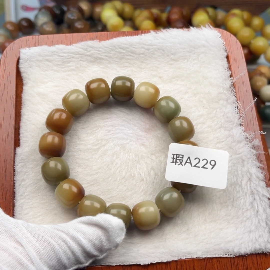 菩提根/象牙果吊坠安****?瑕A229桶珠13mm一串