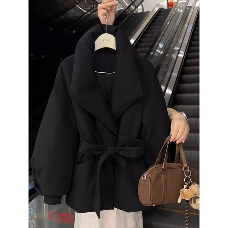 黑色大翻领系带收腰棉服女2025冬季新款中长款气质百搭高级感外套
