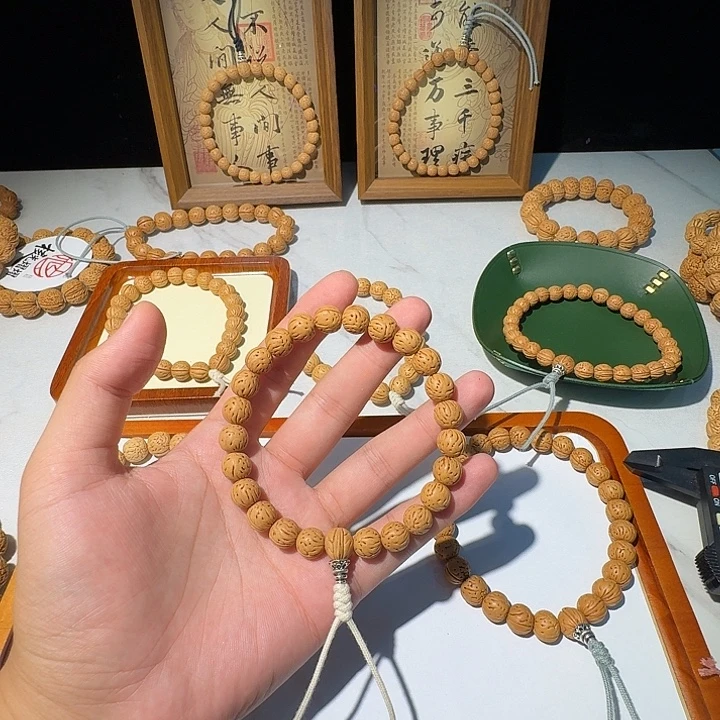 遇****手串桃核野生三道筋