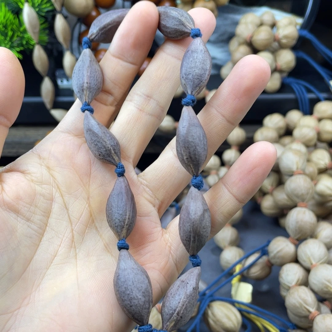 郑***计吊坠橄榄核001.紫皮全紫