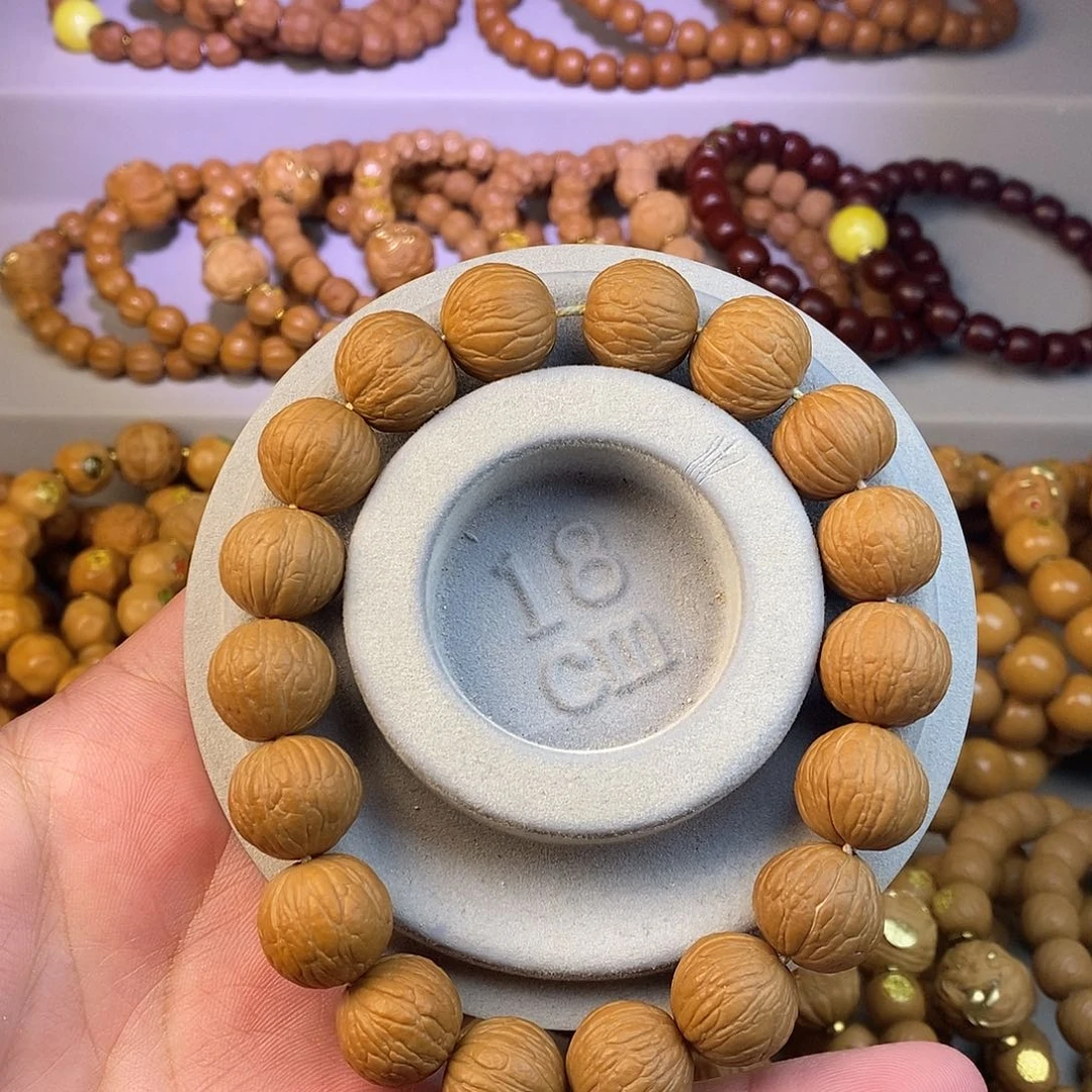 猴头核桃手串原皮凤羽手持