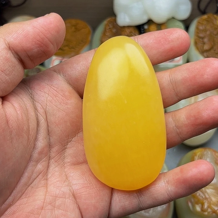 吃***明石材方解石手把件