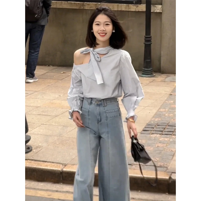 今年流行的漂亮蓝色斜肩衬衫女早春2025新款别致绝美长袖小衫上衣