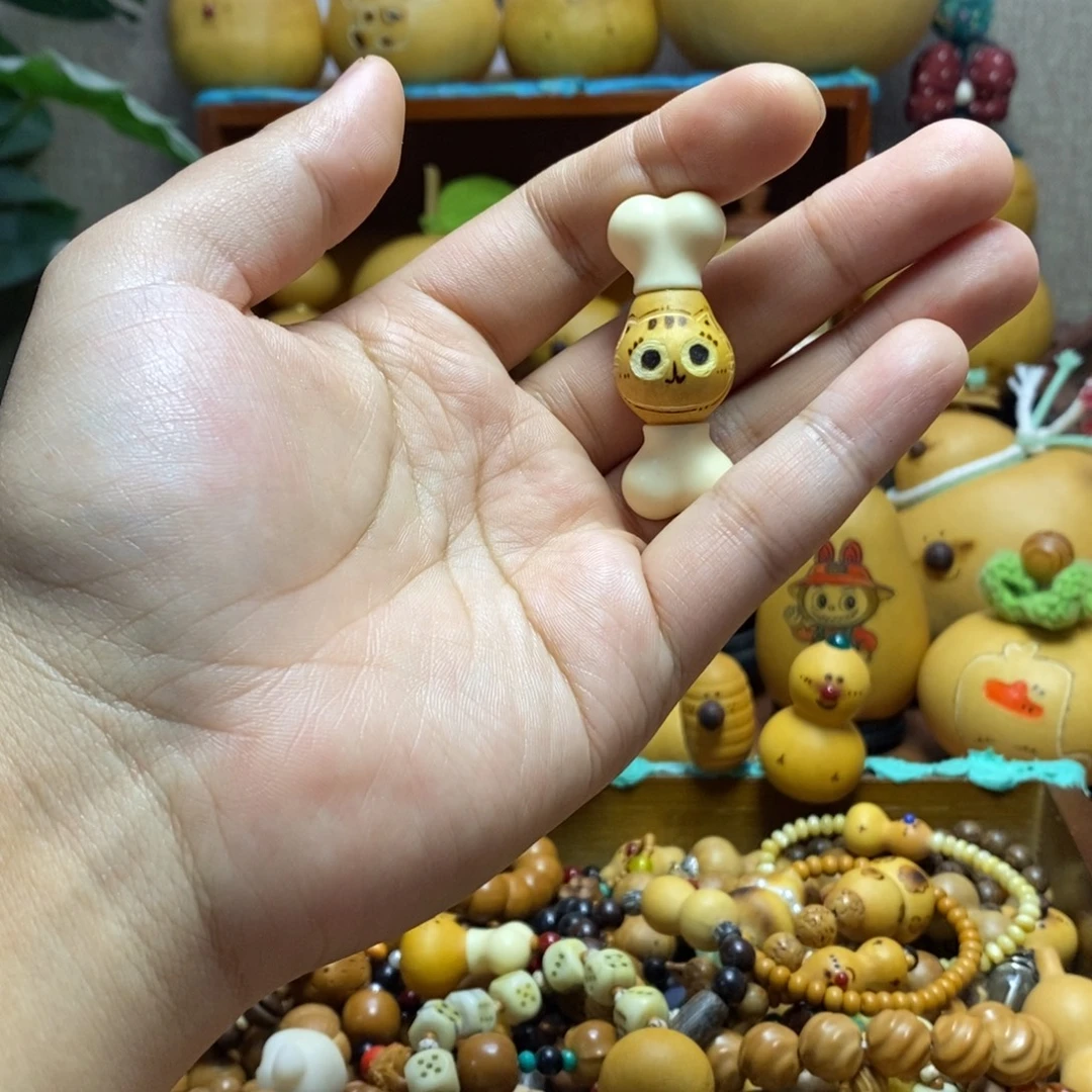 小猫店双骨头手把件