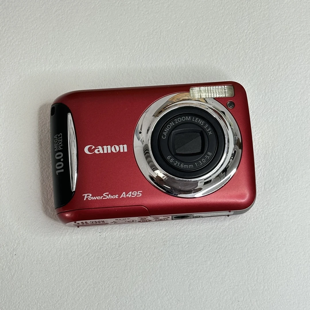 9新 Canon/佳能 A495 1000w像素3.3倍光变 自备5号电池电池盖微翘