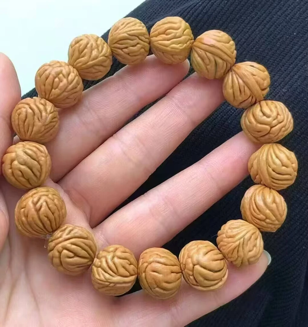 秦岭野生龙纹桃核霸王龙金鱼肚原桩爆肉手串