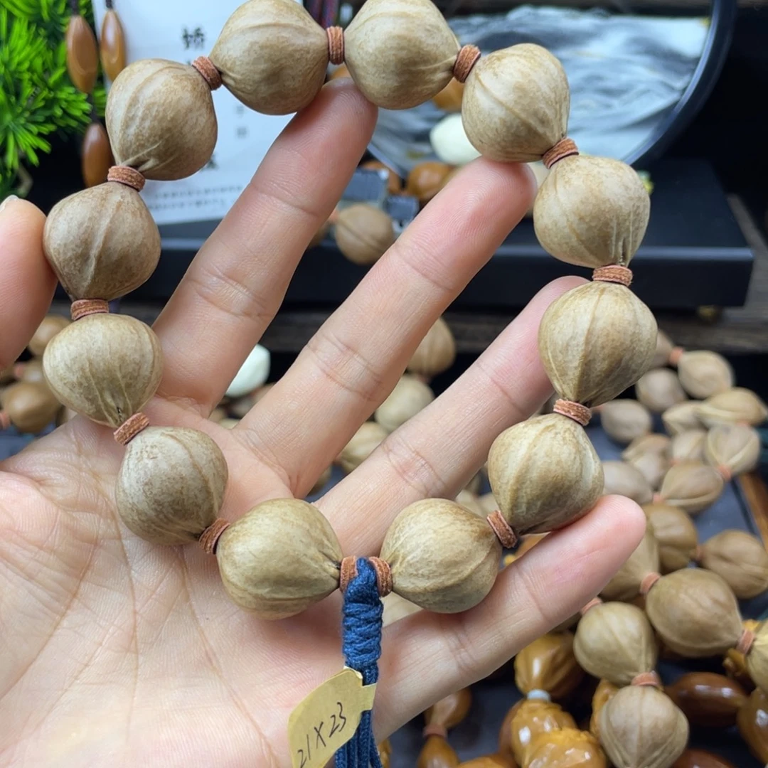 灰***默吊坠橄榄核006.21x23