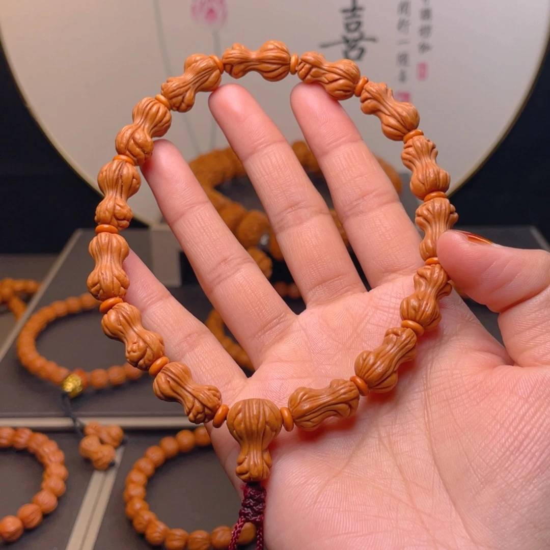 非***桃核吊坠花生手持