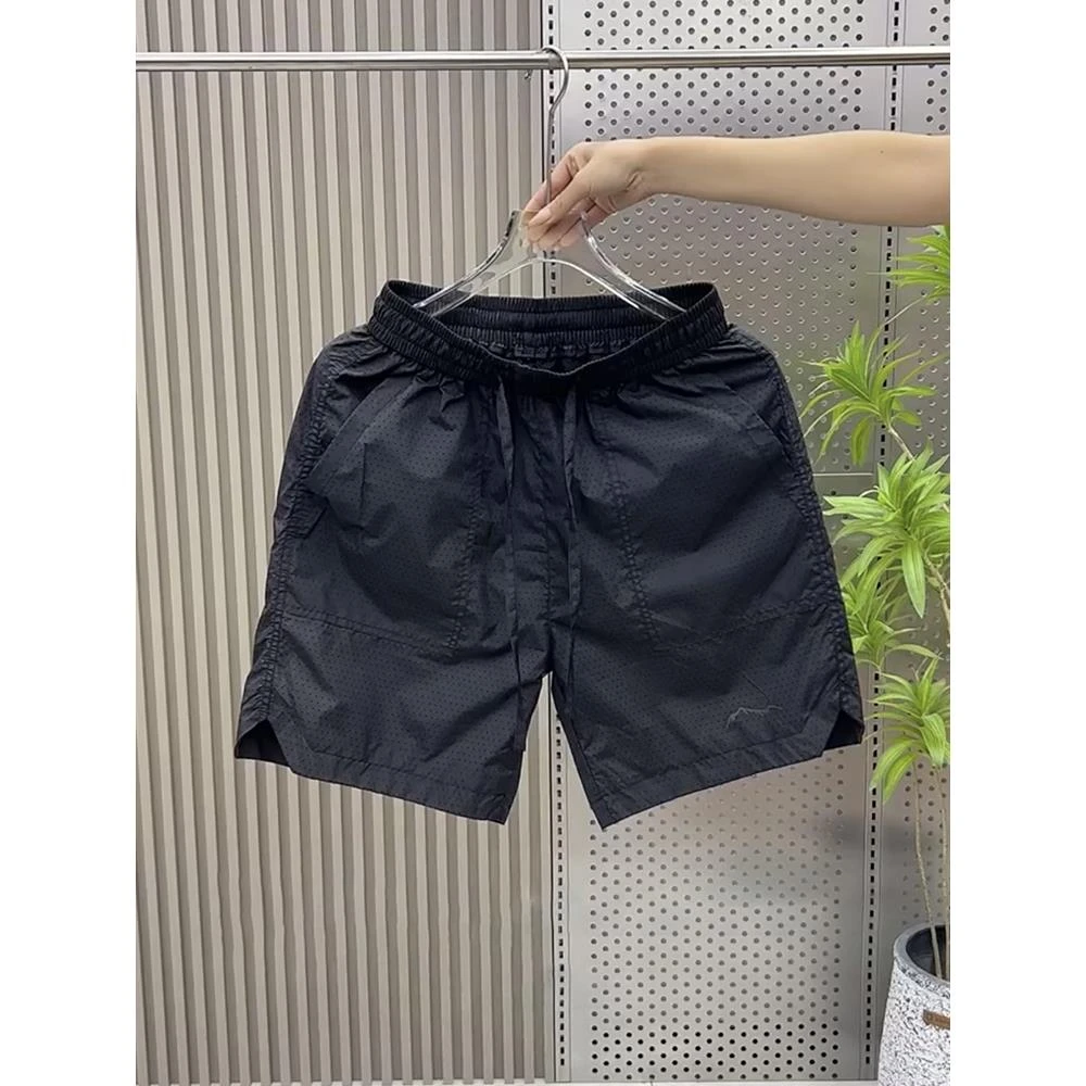 2025夏季透气打孔运动裤男潮流速干休闲短裤子宽松开叉五分沙滩裤