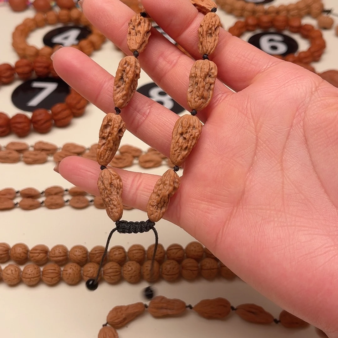 秦***人吊坠文玩核桃异形手串