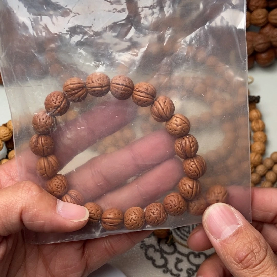 野生小桃核11尺红皮手串特价