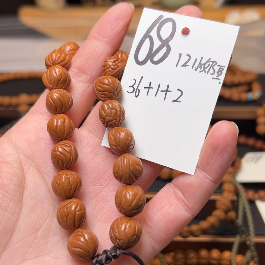 鑫***爷把件文玩核桃秦岭龙纹桃核12小奶豆手持