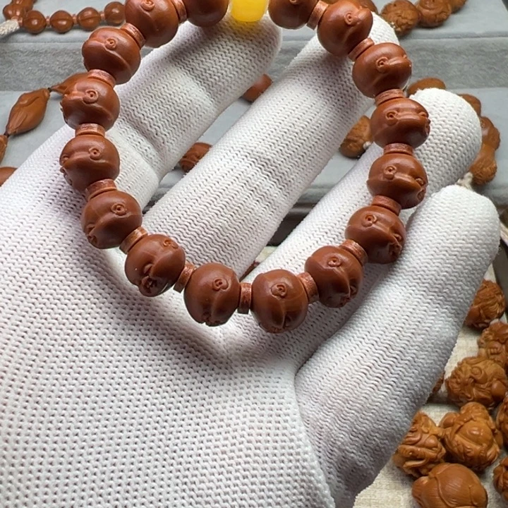 做***己橄榄核手串橄榄核雕工艺制作
