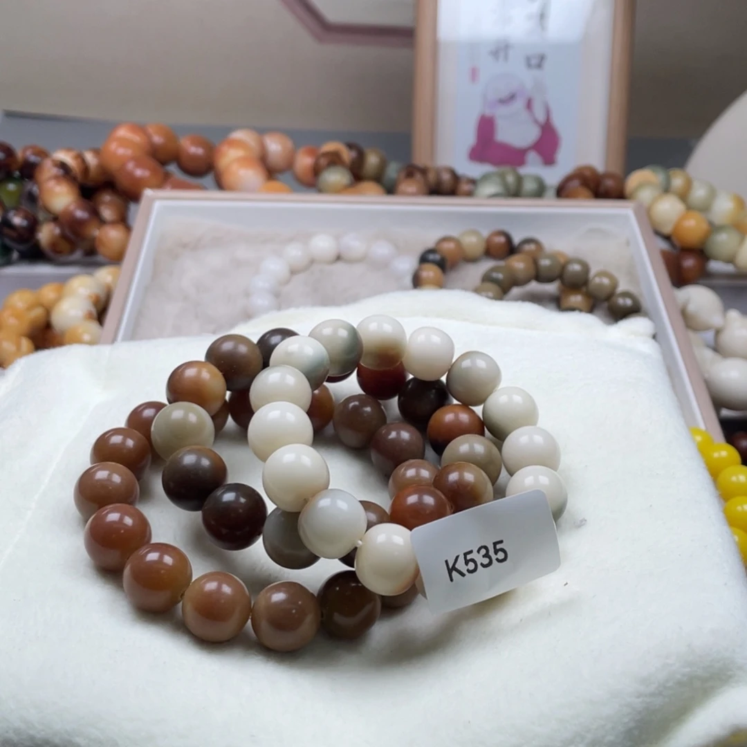 厉****吊坠菩提根/象牙果K535三串13-14mm瑕