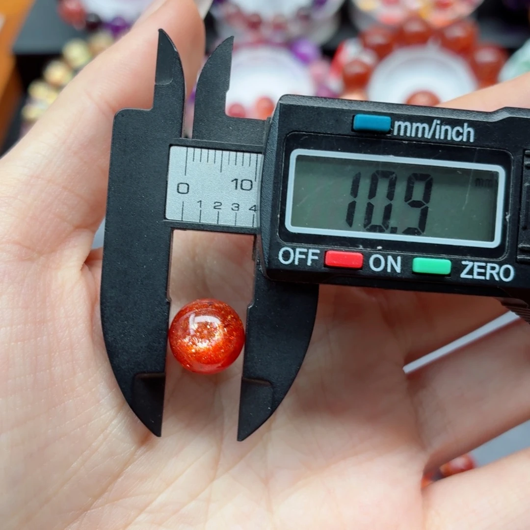 雨***航日光石裸石金太阳单珠10.8左右