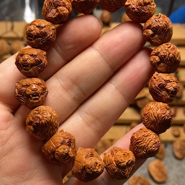 停***风桃核雕刻虎头手串