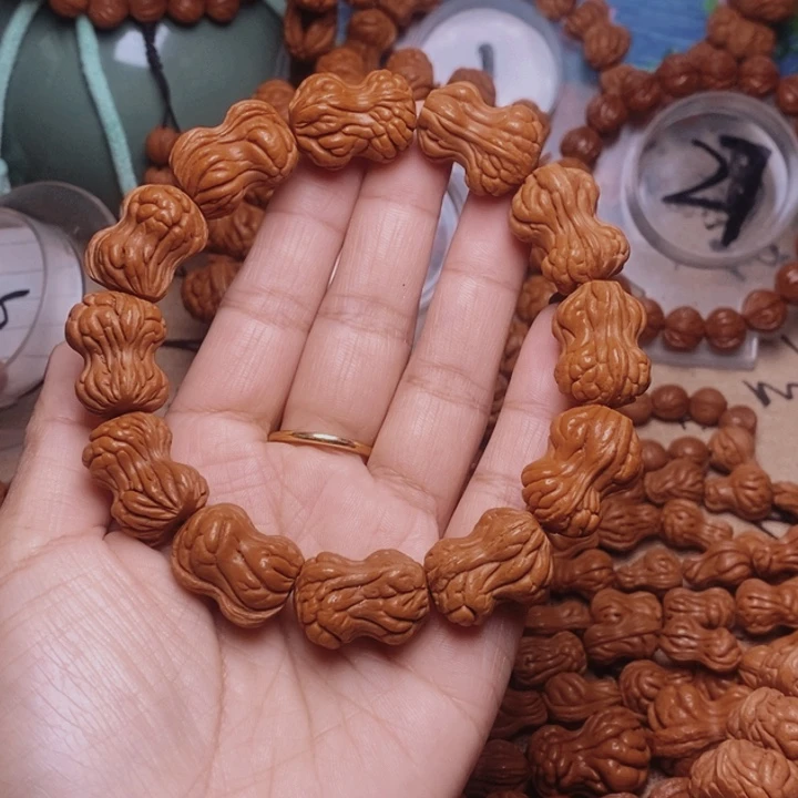 郭***哥文玩核桃手串龙纹桃核