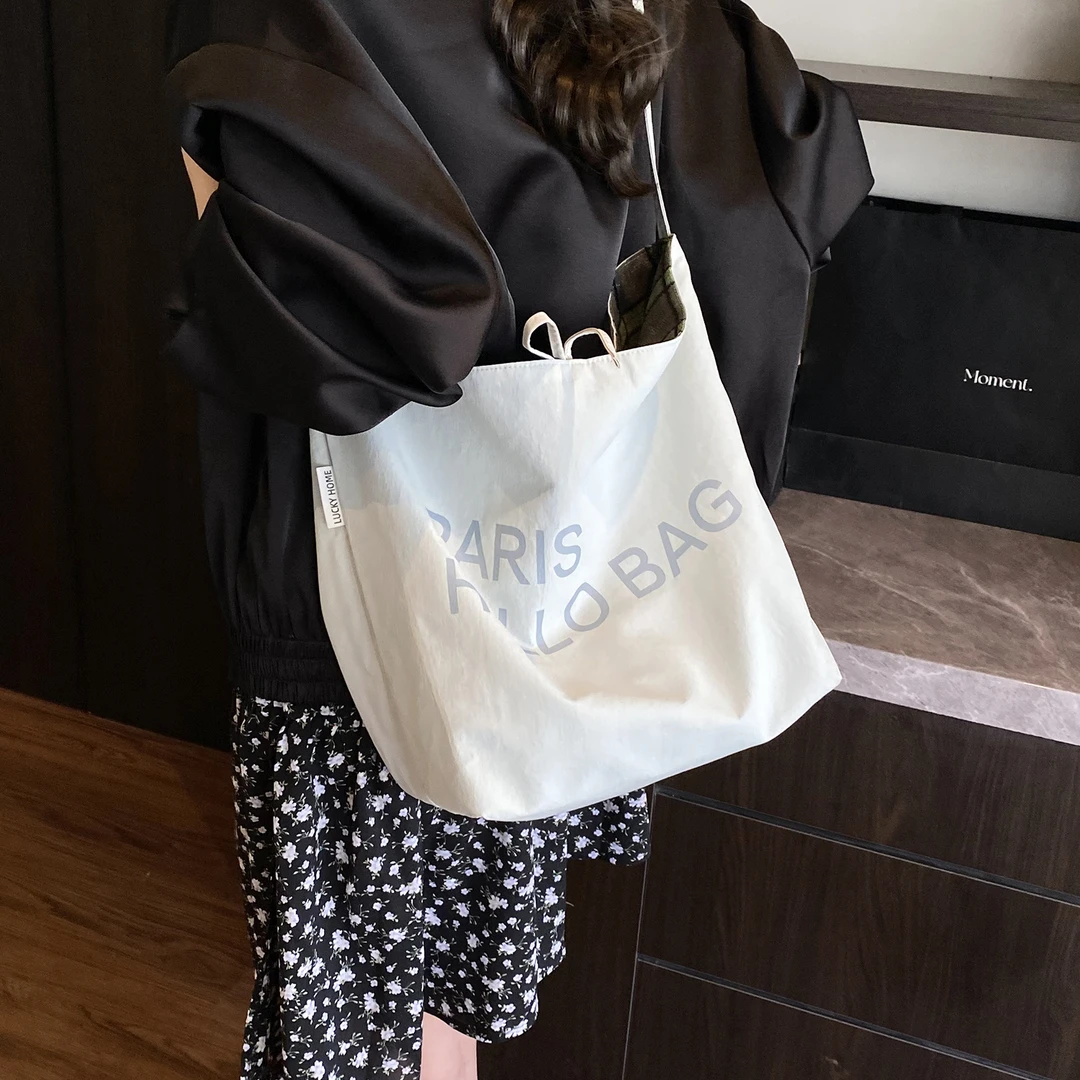 韩版女2025帆布托特包文艺复古大容量字母印花单肩斜挎包