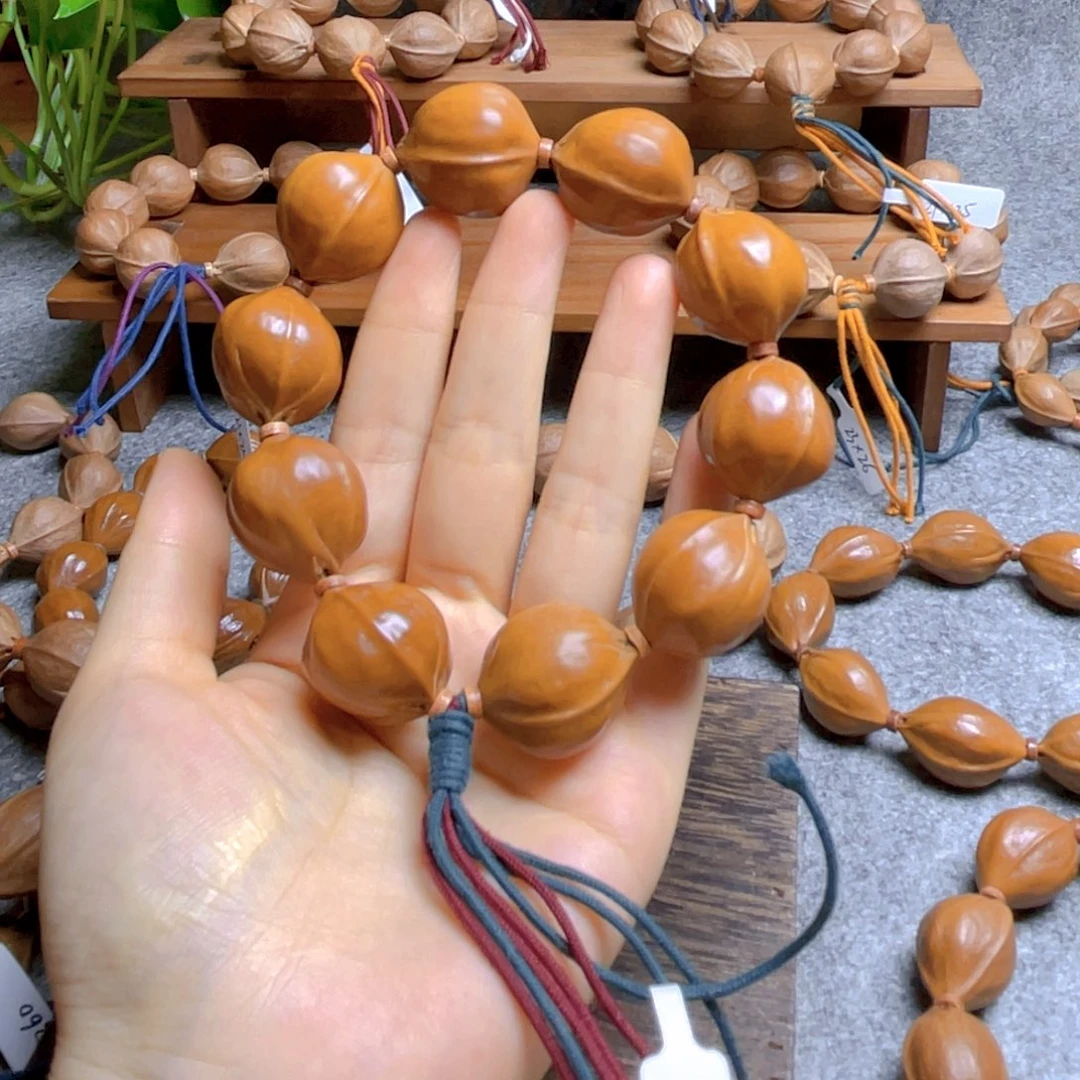 爱***人手串橄榄核梅林铁核2326