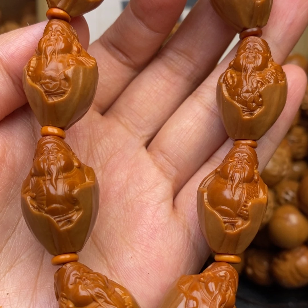 橄榄核吊坠包衣财神