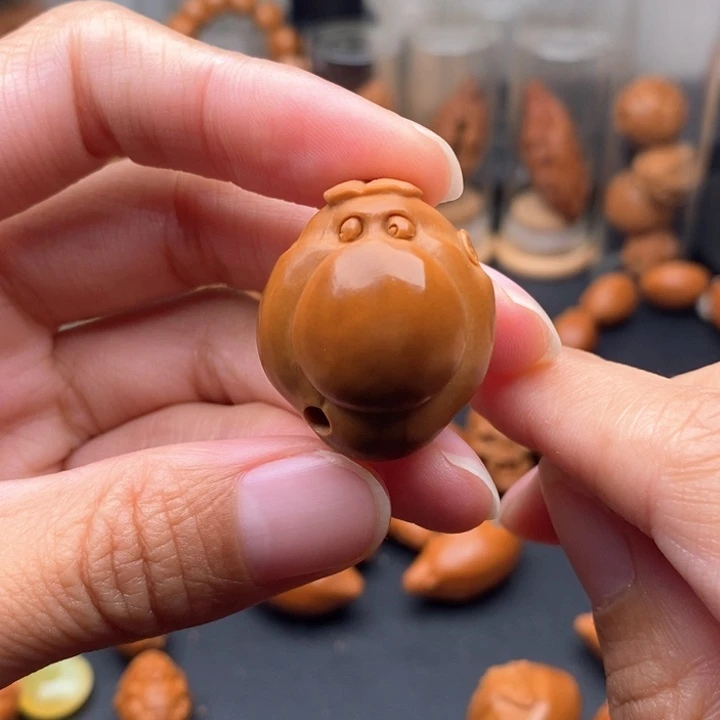 沐***店橄榄核吊坠表情包大鼻子