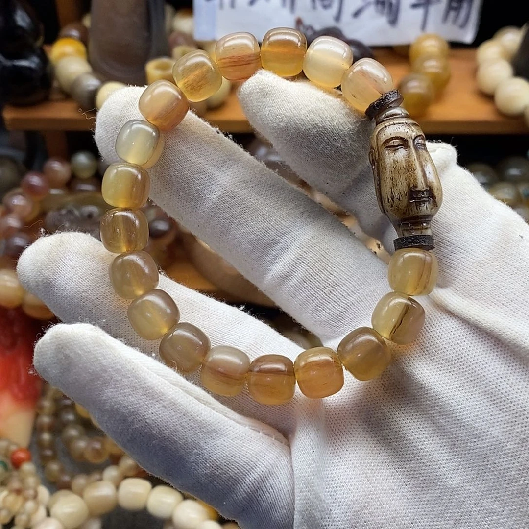 布艺非金属10x9mm老型珠非洲黑斑岭羊角手串