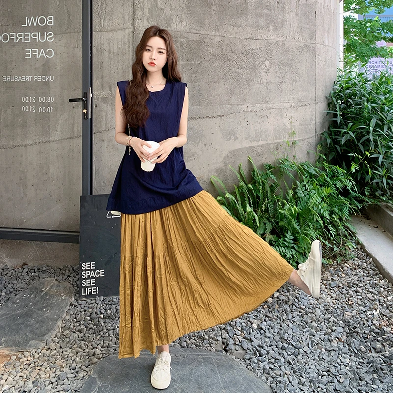 大方得体穿搭套装裙女夏藏青色设计感马甲南瓜色高腰半身裙两件套