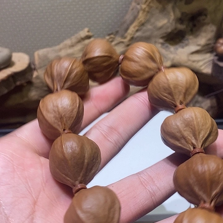 如***影橄榄核吊坠梅林正四花