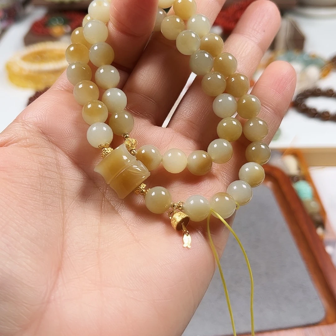 来***圈和田玉18K金镶嵌手链