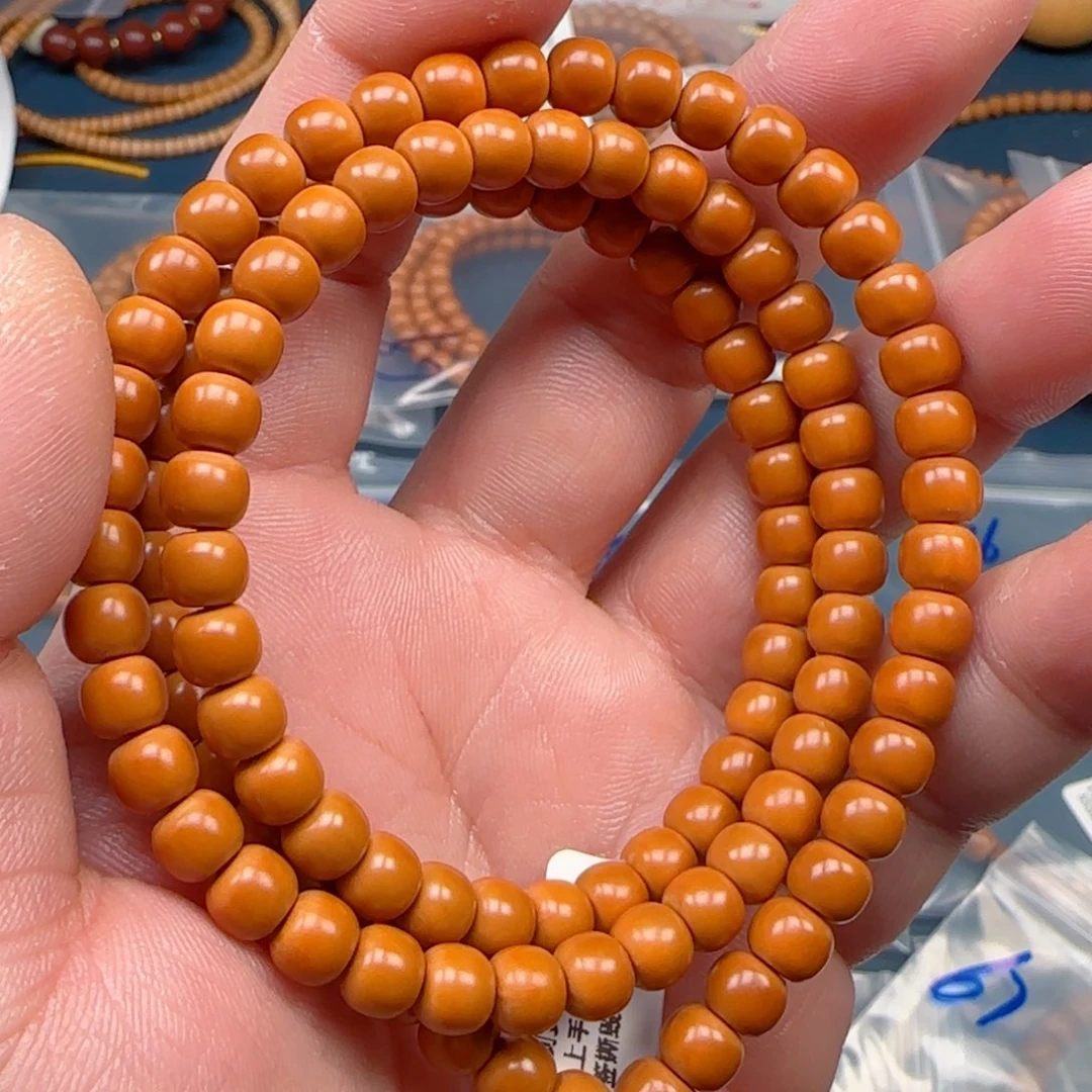 橄榄核手串老挝SS级核尖极限弧尺寸5.8×130颗全无白