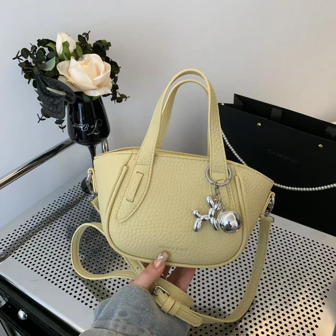 轻奢定制饺子包夏季时尚小众女士手提包包百搭简约水桶包斜挎小包