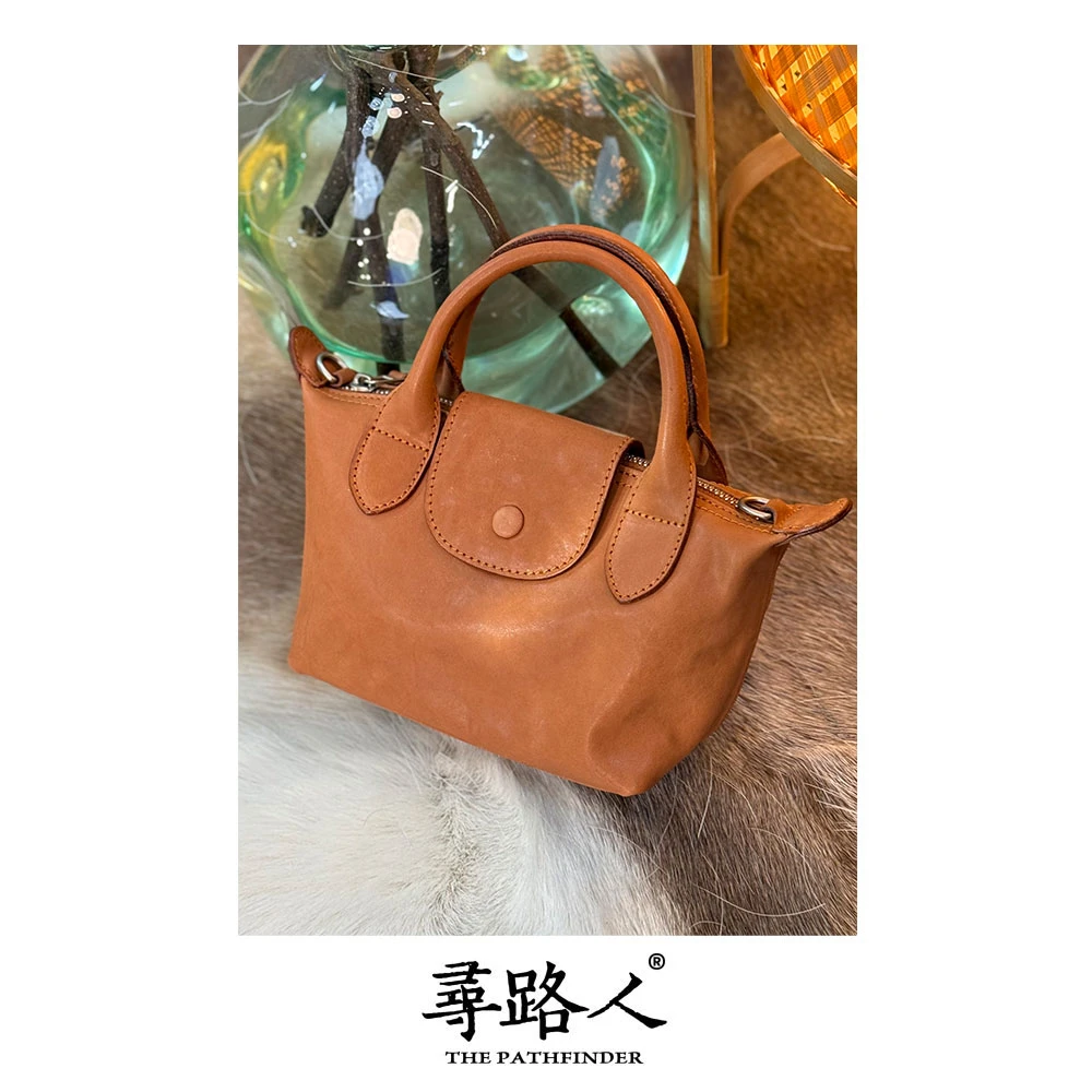 寻路人百搭通勤风女士牛皮手提斜挎包小饺子包