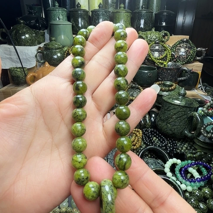 蛇纹石玉未镶嵌珠宝半成品藏玉药王石福利款黄翠1.0手持