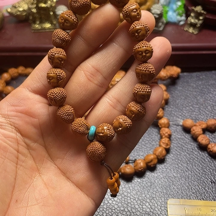 龙纹桃核雕刻宝宝佛