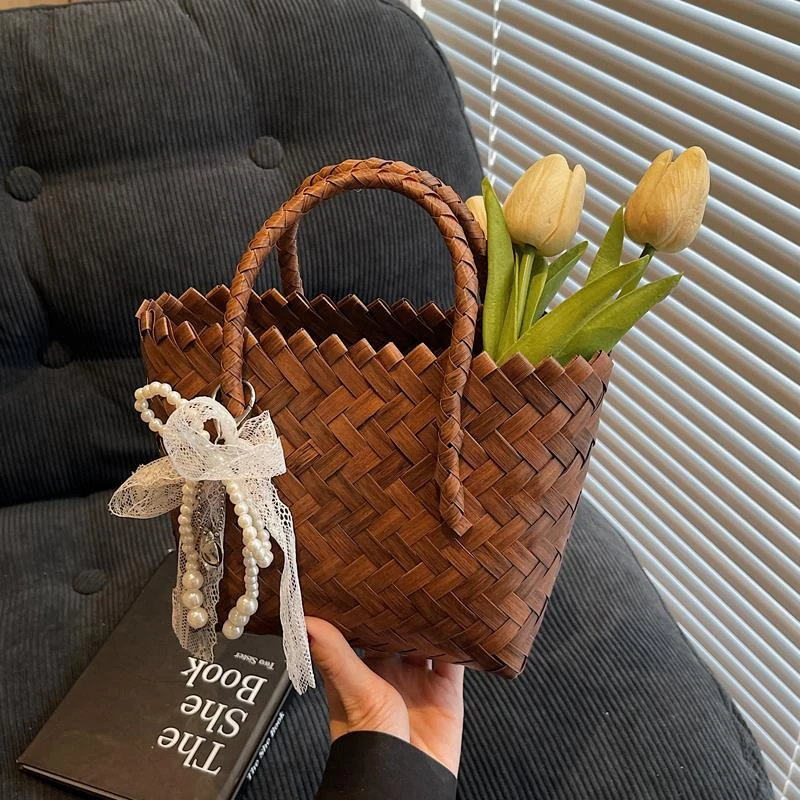 手工编织包包女式2025新款潮流行爆款托特包大容量沙滩度假草编包