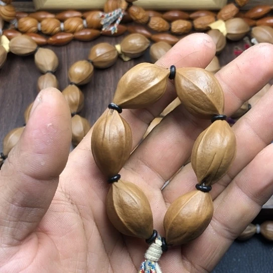 李***虎橄榄核吊坠啦咯么